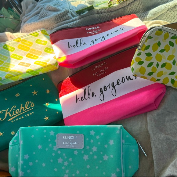 kate spade Handbags - Lot. New cosmetic bags and brand new Kate Spade bag belt.